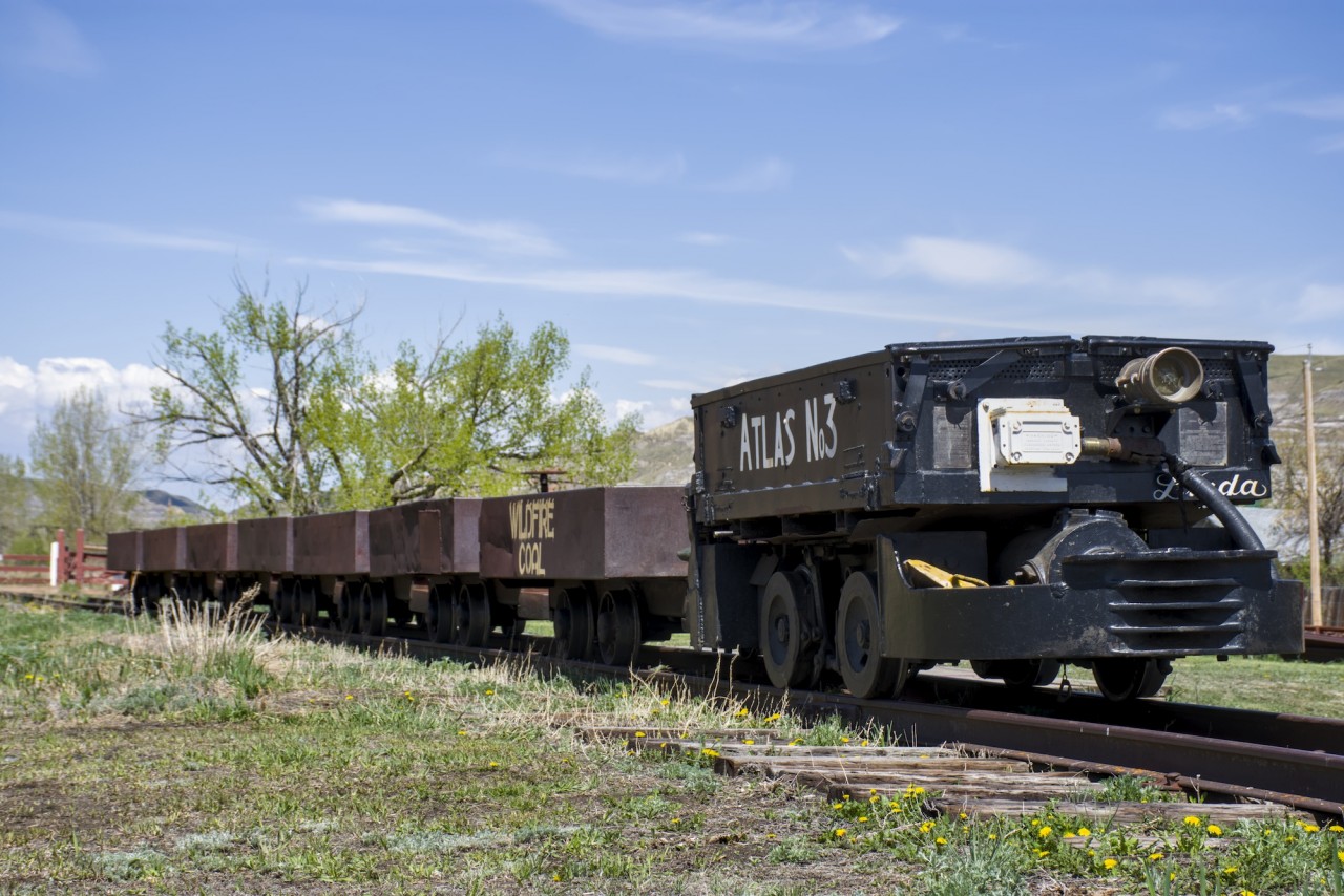 The only battery electric locomotive still running at the historic Atlas Coal Mine in Drumheller. Here, the #3 is sitting with a string of cars waiting for their next load of passengers.