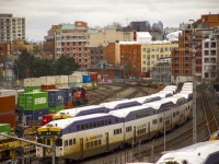 The CPKC Cascade yard (Mile 128). Here we see three WestCoast Express trains and CPKC 2094 sitting in the yard with a cut of intermodal cars. Chinatown can be seen just to the right. 