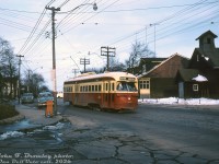 TTC PCC 4315 (A6-class, built CC&F 1947) is operating on the Carlton route heading westbound on Gerrard Street East, pausing at the streetcar stop at Golfview Avenue to pick up a passenger (note the closing doors). Most of the houses appear to have remained intact, but the church on the right has since been replaced with a larger, more modern building. The orange newspaper box would be for the Globe and Mail, and in the distance (behind the blue car) one can see part of a green "Evening (Toronto) Star" delivery van approaching.<br><br><i>John F. Bromley photo, Dan Dell'Unto collection slide.</i>