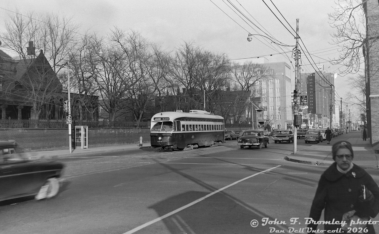 TTC PCC 4404 (A7-class, CC&F 1949) heads westbound on Bloor Street West at St. George Street. At the time, this stretch of Bloor was home to the busy Bloor streetcar route, until it was replaced with the newly constructed crosstown Bloor-Danforth subway line in February 1966. The building on the left (NE corner at 135 St. George) is The York Club, a very old social club founded in 1909 and still present there today. In the distance is the large office tower at Bedford (that at one point housed Texaco offices), and beyond are the high rises and stores around Bloor and Avenue Road (including the Park Plaza Hotel). The University of Toronto's sprawling St. George campus to the south is on the doorstep to all of this.

In all my time collecting slides/negatives and looking at old photos, I've never seen a photo of a streetcar taken here, except this one. Most photos in the area tended to have been shot to the east near Bedford due to the appeal of activity around the old streetcar loop, or to the west at Spadina. Having done a stint at UofT in the past, I passed by this intersection daily going to/from the subway, but never grasped a streetcar once stopped here as I waiting for the light to cross. A heartfelt thank you to people like the late John Bromley, Robert McMann, and those older photographers (some still with us) for documenting such scenes of the past.

John F. Bromley photo, Dan Dell'Unto collection negative.