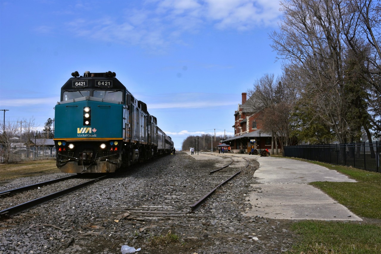 The train still stops here  
Even though the two tracks in front of the station are out of service or torn up, VIA 693 and VIA 692 the trains to and from Churchill, MB still make a scheduled stop at Dauphin, MB. 
VIA 692 is pictured here during its return trip from Churchill to Winnipeg on a beautiful May 2, 2026 afternoon. 
Passengers have the opportunity for a leg stretch, some fresh air, and a quick visit to the Dauphin Rail Museum located inside the majestic station building. 
The station was built in 1912 by the Canadian Northern Railway to a design by architect John Schofield. It was designated a Heritage Railway Station of Canada in 1990. 
The consist for VIA 693/692 on my recent trip was 
VIA 6421 F40PH-2 locomotive 
VIA 6455 F40PH-2 locomotive 
VIA 8602 baggage car 
VIA 8100 economy coach 
VIA 8122 economy coach 
VIA 8503 Skyline dome 
VIA 8224 Chateau Roberval sleeper