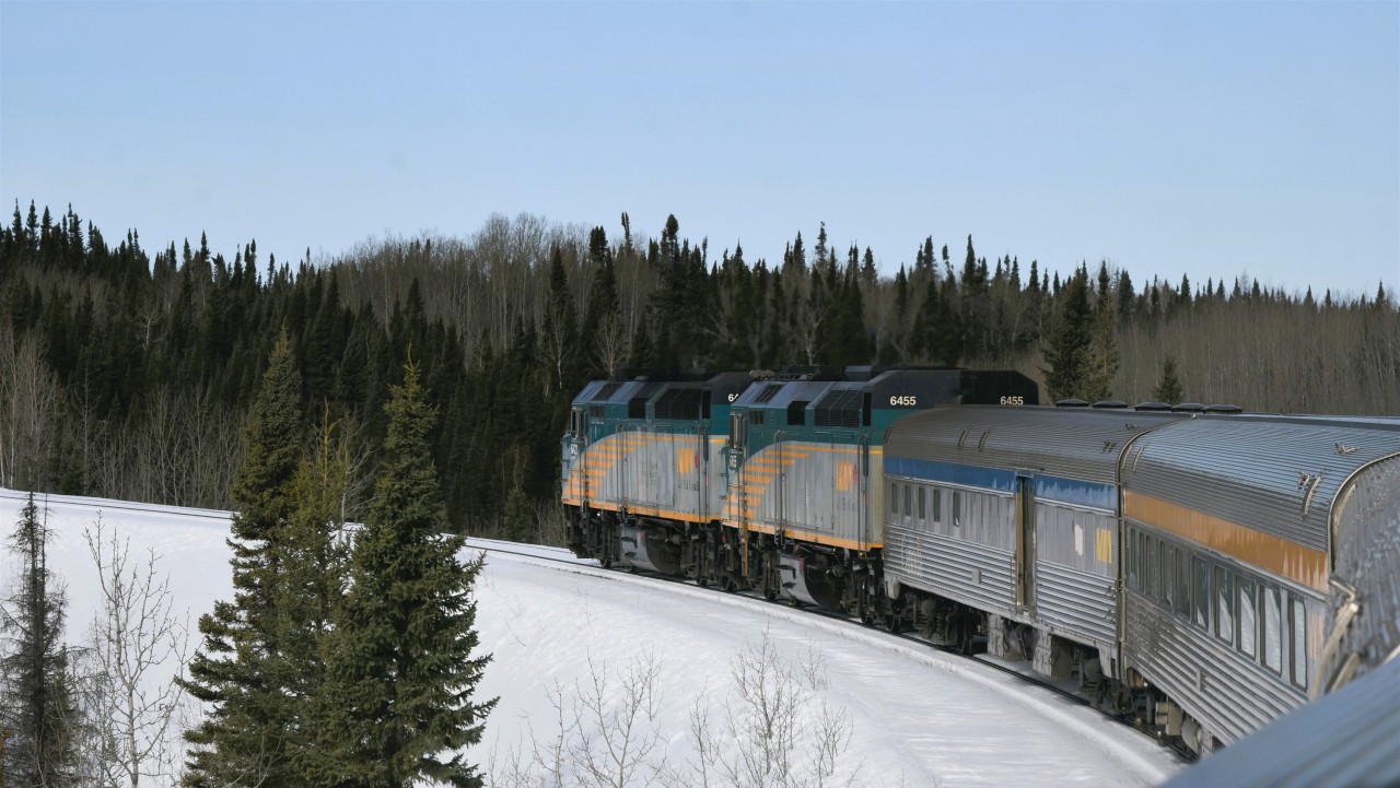 10 per on the curve  
VIA 692 pokes along at 10 m.p.h. heading north on HBR's Thompson Sub. towards the station stop at Thompson, MB on May 1, 2026. 
Numerous locations on HBR's Thompson Sub. drop from the average 30 m.p.h. to 10 in several locations, and 5 m.p.h. through a major bridge work spot. 
The track improvements along the entire route to Churchill have been quite noticeable since 2022 when I began traveling after retirement.