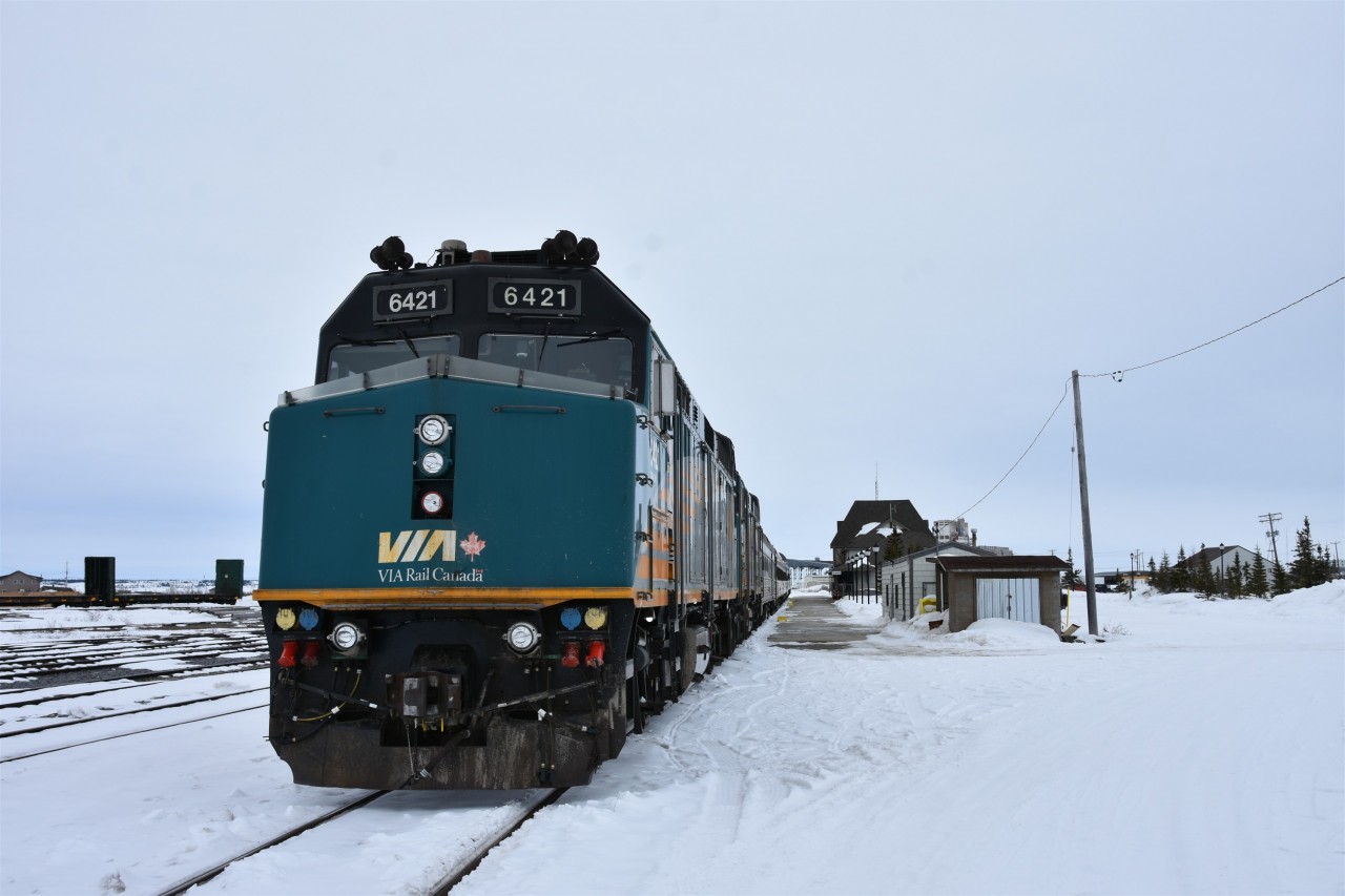Springtime in Churchill  
VIA 693 has just backed into the station track at Churchill, MB on this overcast and -1C April 30th morning with spring nowhere in sight! 
Hudson Bay is still frozen over and the snow drifts on the bay side of the town center complex are still reaching the roofline. 
Even though the sun did not make an appearance during my day in town, I still managed to get a number of good shots while wandering around the HBRY yard and VIA station area. 
A visit to Churchill has never been a disappointment for me! :-)