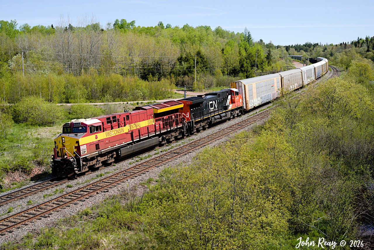 May 24th 2026 @ 11:11, CN A407 (Dartmouth NS to Moncton NB manifest) was led for one day by CN Wisconsin Central heritage unit CN 3069 with CN 3419 trailing, with an average size train of mostly tri-level autoracks consisting of 242 axles.