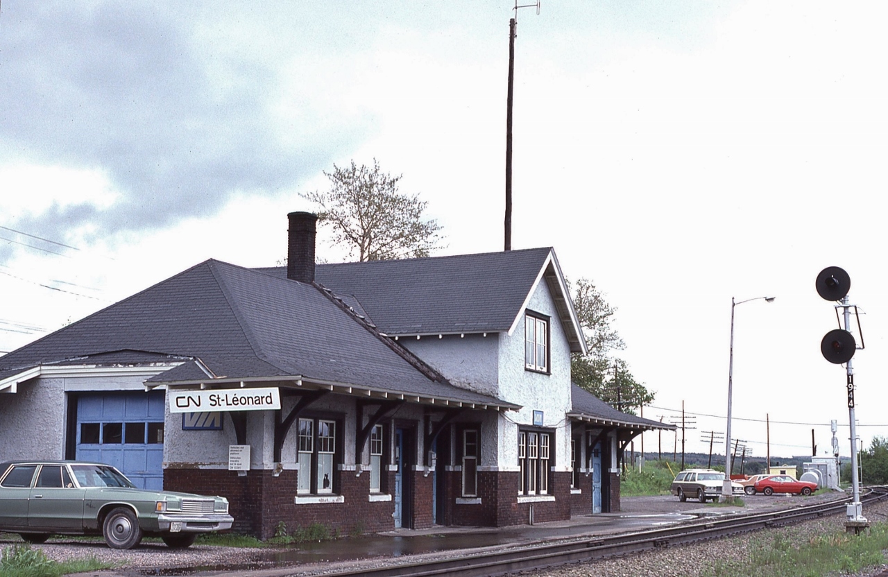 That VIA sign is encouraging,


Daily VIA Budds 619 & 620 (Moncton - Edmundston) served until the November 1981 service cuts, wherein Trudeau's Liberal Federal Transport Minister Jean- Luc Pepin chopped VIA's budget in half.  


at Saint Leonard N.B., mile 194 CN Napadogan Sub-Division, June 10 1981 Kodachrome by S.Danko 


After the November 1981 train offs, VIA service was restored by Progressive Conservative Federal Transport Minister Don Mazankowski  October 1984 with VIA tri weekly Budd car trains 625, 626 & 628 that survived unit the massive January 1990 VIA cuts orchestrated by Progressive Conservative P.M. Brian Mulroney's chopping crew lead by Fed Transport Minister Benoit Bouchard.


Note the jointed rail,


And The Parisienne Atlantica parked behind the light standard.


sdfourty