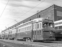 TTC 4369 is one of the PCC's sitting outside the Roncesvalles car house in Toronto sometime between 1969-1971.