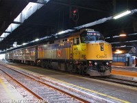 VIA Rail train #85 sits on Track 8 under the Union Station train shed in downtown Toronto, taking on passengers as it awaits its daily 10:55am departure from Toronto to Sarnia. F40PH-2D 6415 does the honours today, with two heavily refurbished 1950's Budd stainless steel coaches trailing. <br><br>This is one for the Guelph/Kitchener fellows that used to get excited for shooting VIA #85, but never shot it in Toronto. Commuting in/out of downtown, the sight of #85 was anything but exciting: always a ho-hum VIA F40 with two stainless steel Budd coaches, all day, every day. Exciting for #85 was when it ran 3 cars, which wasn't saying much, or had one of the <a href=http://www.railpictures.ca/?attachment_id=6825><b>wrap units</b></a>. 6415 also had an ugly yellow mis-match of a patch job on the cab for a while, also unappealing (at least its nose flap was closed today).<br><br>Still, a bit more appealing than a grey, black and yellow Siemens trainset, I suppose...