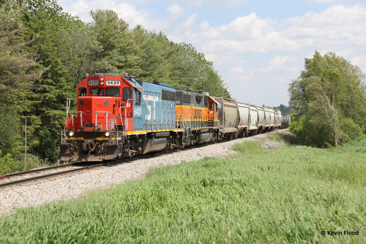 CN 568 heads west out of Kitchener with GTW 6420-BNSF 2090 for power. BNSF 2090 has now been acquired by CN and either patched or repainted into a 49xx number. Honestly, I lost interest after that happened. I enjoyed the original paints while they lasted. This picture was taken shortly after BNSF 2926 (BN green and white) left the Kitchener pool, unfortunately for good. GTW 6420 soldiers on in original paint and is currently back in the Kitchener pool.
