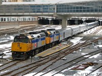Most people seem to shoot The Canadian at <a href=http://www.railpictures.ca/?attachment_id=14678><b>Bathurst Street</b></a> or up at <a href=http://www.railpictures.ca/?attachment_id=52620><b>Snider</b></a>, catching it departing Union Station isn't as photogenic due to all the pedestrian bridges, the tight corridor, and limited spots to shoot the entire train. However, since we were in the area one afternoon, a late departing #1 offered the opportunity to quickly catch it departing Union Station on its cross-country trip to Vancouver, roughly an hour and a half late (regular departure time 9am).<br><br>Today's consist was lead by VIA F40PH-2D units 6412 and 6404, followed by baggage-dorm 8606, coaches 8103 and 8139, Skyline dome 8517, sleepers Stuart Manor, Craig Manor, Osler Manor, Skyline dome 8500, diner Palliser, sleepers Brant Manor, Lorne Manor, Bell Manor, and dome-observation Waterton Park on the tail end, still under the train shed.