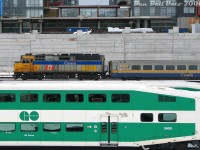 After finishing its morning run into downtown Toronto from Niagara Falls, VIA train #90 with F40PH-2D 6419 and 4 LRC cars backs its consist from Union Station to the Toronto Maintenance Centre in Mimico, passing GO bilevels laying over at Bathurst North Yard, and new Cityplace condos under construction on the former "railway lands" between Spadina and Bathurst Street (once home to the <a href=http://www.railpictures.ca/?attachment_id=38600><b>Spadina Coachyards</b></a>, that the VIA TMC replaced in the mid-80's).