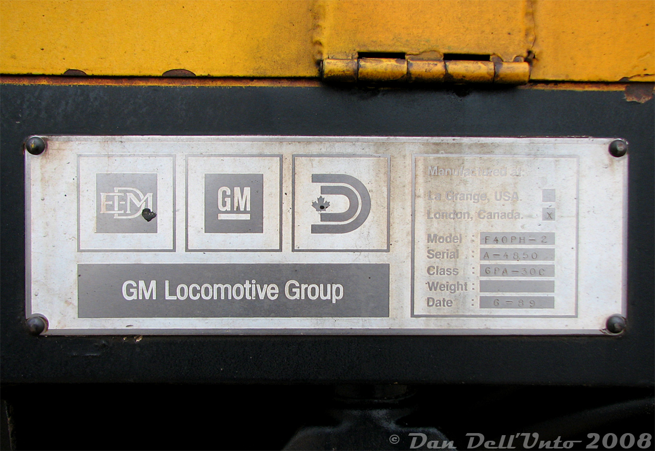 The credentials of VIA F40PH-2D 6449 are visible for all to see on its builder's plate, captured during a station stop at Brampton Station downtown. At the time, the higher-numbered F40 units were western-assigned (out of Vancouver) for The Canadian, and rare to see on corridor trains in the east.

This "F40PH-2" is serial number A-4850, class GPA-30C (VIA's adoption of CN's diesel classification system), built 6-89 at London (Ontario), Canada. The logos visible are for EMD (Electro-Motive Division), GM (General Motors, parent company), and the Diesel Division of General Motors Canada Ltd (EMD/GM's Canadian branch, sometimes called General Motors Diesel Division - GMDD or DDGM - originally known as General Motors Diesel Ltd (GMD) for many years after the London, Ontario plant opened in 1950). All part of the "GM Locomotive Group" (GMLG - confused yet? All this became EMD when GM sold their locomotive business to Greenbrier). The exact model listed is F40PH-2, but I understand the D was either officially or unofficially added due to its desktop controls (sort of like all the widecab GMD units on CN where the W is not an official GMD or CN designation). All rebuilds became "F40PH-3D".

There was a well-known roster fellow (who shall not be named) on one of the Locomotive groups online a number of years back that, during a discussion about what VIA's units were actually called, kept rebuking everyone and insisting that the actual designation of VIA's units was just "F40PH". One day I had had enough and posted this photo of 6449's builder's plate clearly showing "F40PH-2", and he got quiet real quick. I guess nobody behind the keyboards bothered to check the builder's plates on them.