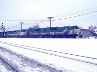 Just over a dozen years ago I posted an image taken at Aldershot showing 4 GO units on weekend lease to CN. Comments were that "I didn't know CN leased GO" to, "are you sure this isn't a CP train over CN"?? as it did look rather unusual to say the least.
After all this time, I found a slide I knew I had that pretty much confirms this was a CN train and they indeed leased GO power for a time.
This image shows GO 9801, 9804, 710 and 709 powering a CN train as it is heading up the Halton Sub to MAC.
And it is late day on a Sunday, so I would assume they had to get this power back to GO in order for the units to be ready for morning.  Just assuming. On the right is the "Burlington" sign before they added "West".