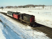 While hanging out at one of the wooden bridges over the CN line at Newtonville, this unexpected move came by.
Back then, no communication like there is today, so no one to ask and no idea where the baggage car was heading.