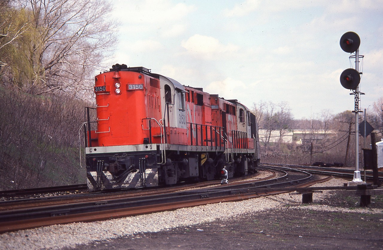 CN 3150, 3152 lead a westbound passenger train thru Bayview Junction. The (Tempo) units, built @1960,  would be retired within 4 years.