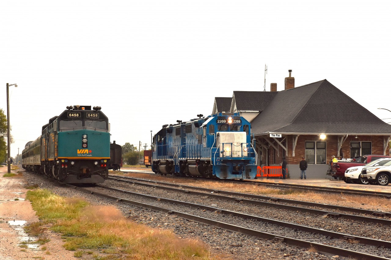 Unfortunately it's a rather grubby morning at The Pas.  At least we did not have to worry about sun angles, which could hinder shooting northbound trains in the mid-morning.
Here at the former CN (now Keewatin) station is, on the left, VIA 6458, 6428, the power for the #691 train to Churchill. The other pair, PRLX (former GATX reporting marks) 2269 and 2265, is the power for KRC's "Puk train" (Pukatawagan) which was made up and leaving shortly after this image was taken. 
The train, running twice weekly, is the only ground connection to that community of 1500 souls.