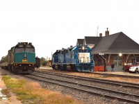 Unfortunately it's a rather grubby morning at The Pas.  At least we did not have to worry about sun angles, which could hinder shooting northbound trains in the mid-morning.
Here at the former CN (now Keewatin) station is, on the left, VIA 6458, 6428, the power for the #691 train to Churchill. The other pair, PRLX (former GATX reporting marks) 2269 and 2265, is the power for KRC's "Puk train" (Pukatawagan) which was made up and leaving shortly after this image was taken. 
The train, running twice weekly, is the only ground connection to that community of 1500 souls.