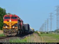 CPKC Train #135 hurries across Essex County, bound for Windsor, in the late afternoon sun with KCS ET44AC #5009 on point as it approaches Renault Line in Emeryville, Ontario on May 29, 2026.