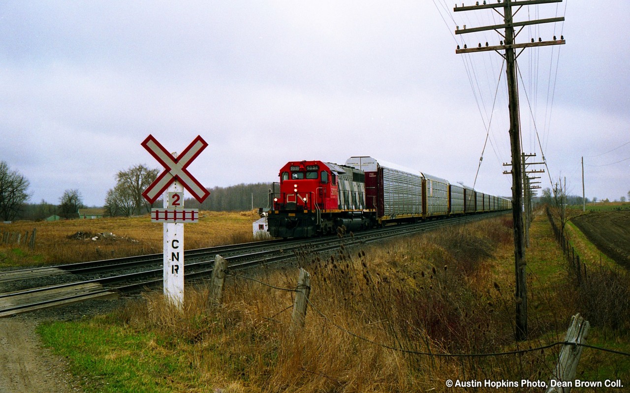 CN SD40 5036 crossing the CP/CN Diamond at Melrose.