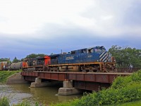 A friendly wave as BCOL 4653 and CN 2250 cross the Belle River with train 438 at mile 90.2 on the Chatham Sub.