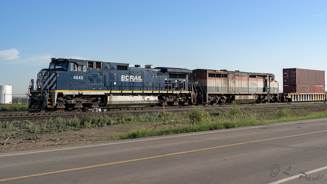 The 4645 and 4617 slip past Clover Bar as they take a train of containers into Edmonton. Time was 7:45 on a sunny June morning.