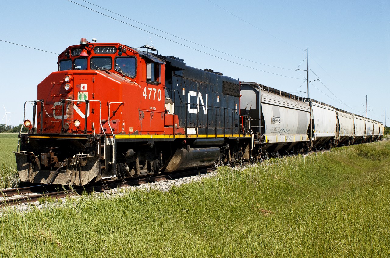 The local is always a fun one to shoot. With how flat the scenery is, I often wonder what passengers thought when once riding this section of line all the way to Erieau. 


Nonetheless, CN 514 is on it's way back to Chatham this late sunny afternoon, after servicing Blenheim slowly rolling through our vast farmlands here in Chatham-Kent.


This wasn't my only catch of the day though. I was also quite lucky to finally get my only photos of ex-Thompson's old tonner. It was a great day for photography!