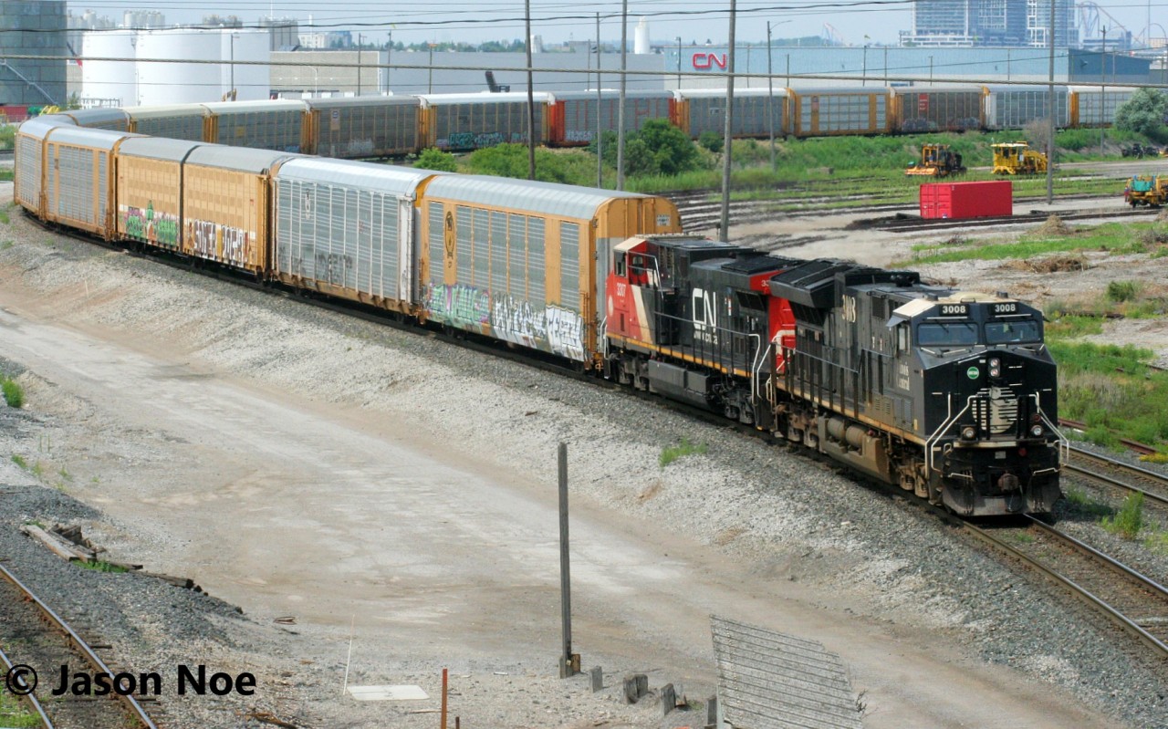 CN train 301 is viewed departing MacMillan Yard in Vaughan, Ontario with CN’s Illinois Central heritage unit 3008 leading and 3307 trailing.