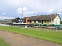 CN NW2 impatiently waits for passengers from the NMRA 6th Division Meet to board at the Alberta Railway Museum gift shop for a train ride (several "back and forth" passes on museum grounds). NW2 7944 was built by EMD in Lagrange in 1946 and donated to the Museum by CN in 1977. Former Montreal commuter car 6740, built in 1952 (an MU trailer in service until 1995), is on loan from Alberta Prairie Railway Excursions in Stettler according to the Canadian Trackside Guide. The station was built by the Canadian Northern Railway in 1909 and moved here in 1973. (The station building now in St. Albert is a replica.)
