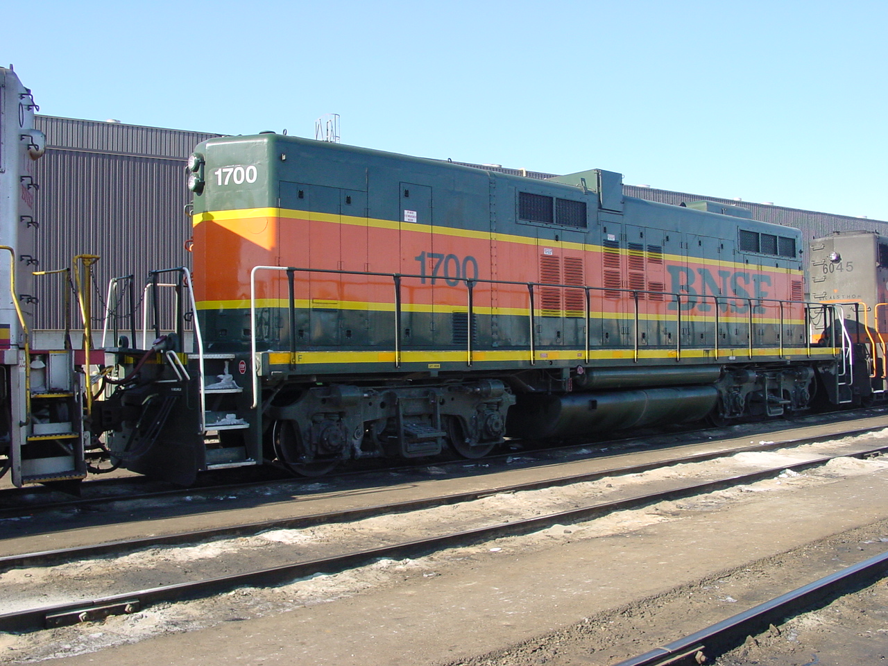 To B on not to B? July 2/03 at Mac Yard outbound shop track BNSF GP9B #1700 a very rare unit in general, but to be this far from home rails is unusual. 

BNSF 1700 is an EMD GP9B locomotive. Built in the 1950s for Northern Pacific as #267.  Burlington Northern (BN) rebuilt from wrecked GP9s. As of this date, BNSF had 4 GP9B's on their roster.