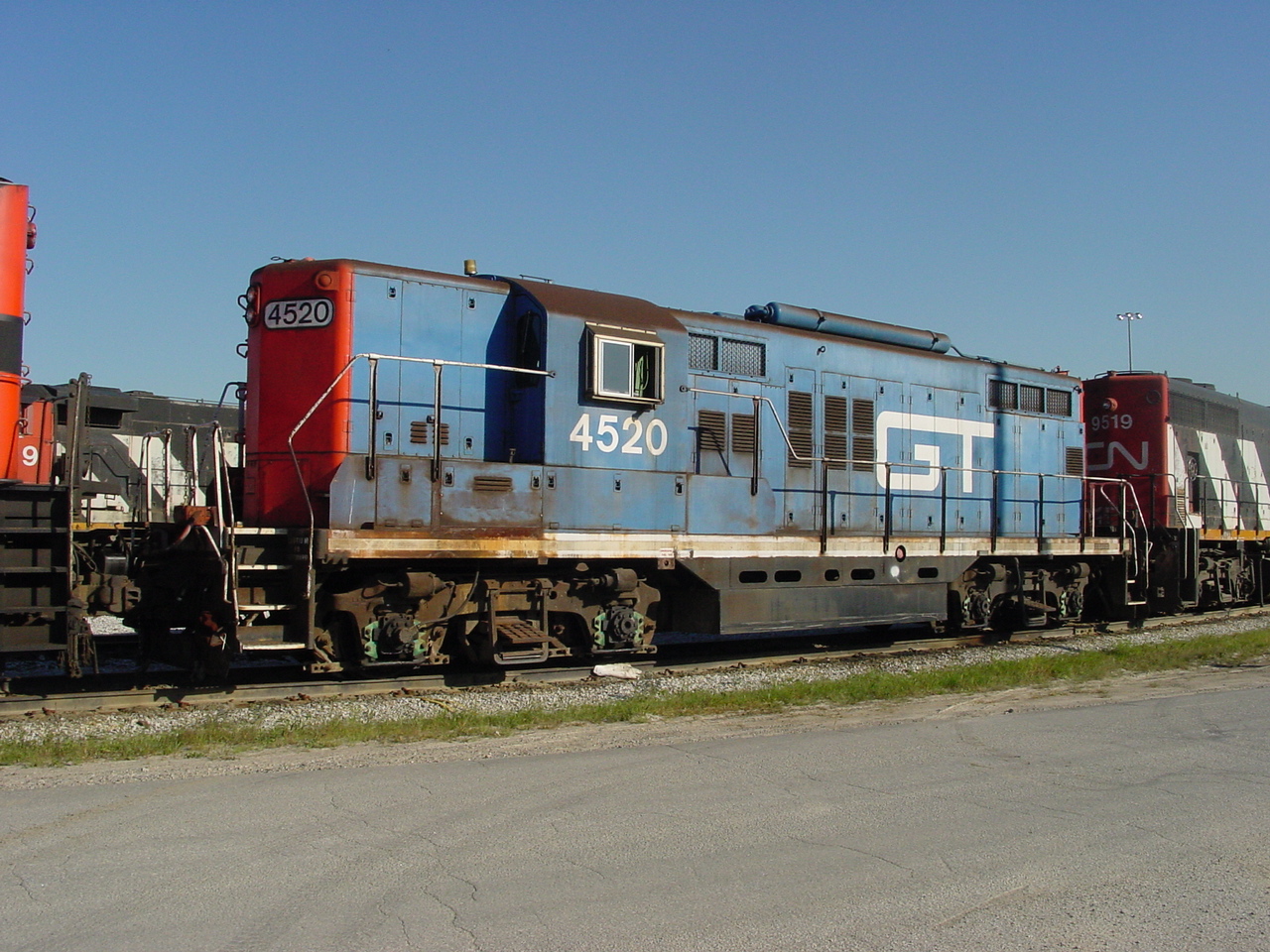 Torpedoes away! 9/5/2001 GTW "Torpedo boat" 4520 is the middle unit of my consist getting ready to depart Oshawa, Ont after making a lift of cars from the  General Motors auto plant in Oshawa. I can't tell the road number from this photo, but the lead unit is either a MLW 630 or 636. While my trailing unit is the ubiquitous GP40-2W #9519