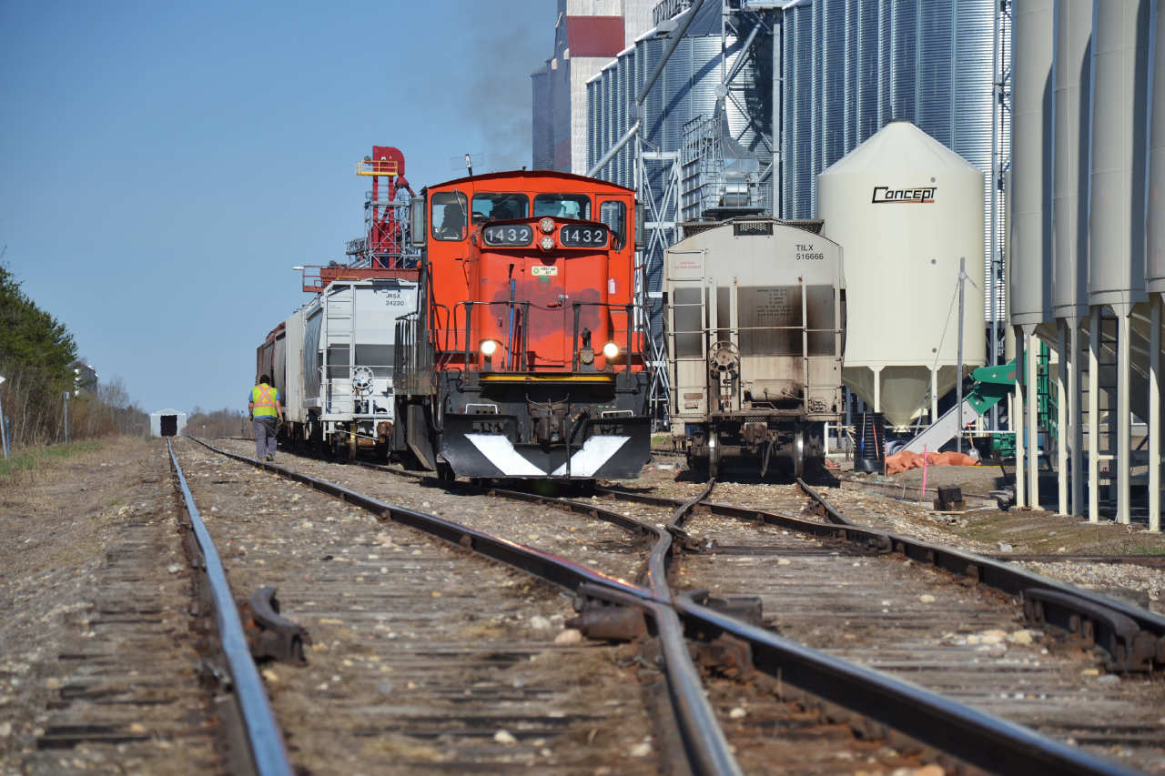 If you told me that there was a former Canadian National GMD-1 still pulling grain hoppers in the Saskatchewan prairies in 2026, I would have thought I was being being led on a goose chase.

Thankfully, I couldn’t be more wrong.

The GMD-1’s were, in my opinion, the quintessential locomotive of the Canadian prairies. These engines were a unique to Canada only model, with Canadian National and Northern Alberta Railway ( a railroad that was jointly owned between the CNR and the CPR, that would end up buying two from the CNR ) being the main customers. Over time, 20 units would subsequently be sold to Cuba and other units to various U.S. short lines as the CNR began to retire them.

Built from 1958 and 1960, the GMD-1 proved to be versatile and well suited for various roles. The 1000 series units featured the A1A ( six axle ) lightweight trucks which were geared for 65MPH, saw extensive use on the numerous branch lines that sprawled across Canada’s vast prairies. 

The B-B Flexicoil ( four axle ) truck variants of the initial batch of GMD-1’s ( 1900 series ) were better suited and geared at 83MPH for the local commuter trains. These units also came equipped with an onboard steam generator, denoted with a G in the class designation. 

These units would go through three rebuild’s throughout their lives. The most noticeable, would come in the removal of the A1A trucks as those branch lines these engines served, began to become abandoned or upgraded to heavier rail. This saw the reduction of the need to have so many lightweight six axle units. These would be swapped out for the B-B Flexicoil trucks.

Numerous unit found life elsewhere outside the prairies they once called home. 
Torch River Rails 1432, ex CN 1432, nee 1602 and when it came off the line in 1958 from GMD, it was numbered 1008. This unit never seemed to have ventured far from home in the west. 

Torch River Rail operates on 28 Miles on the former Canadian Pacific White Fox Subdivision. This subdivision once operated from Nipawin Saskatchewan to Sharpe, where it would then join CN and run into the town of Prince Albert.

In April of 2008, Torch River Railway, which consisted of local investors and four municipal government groups, moved forward to purchase the railway from Canadian Pacific. It serves the four municipalities of Nipawin, White Fox, Torch River and Choiceland, where the company is based out of.

Torch River Railways one and only unit is the as mentioned GMD-1, which was acquired in 2007.

I had reached out to the railway in May of 2026 in hopes to photograph one of the last remaining GMD-1’s in service. At the time of writing this, the unit is approaching 68 years old. A phrase I have heard one too many times, “if not now, then when”?

Here, TRR 1432 switches the elevators and bins within the small yard at Choiceland.