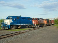 CN YRP003 has twice as many units as cars as it shoves towards the former Longue-Pointe Yard with two GP38-2s sandwiching a pair of GP38-2Ws (CN 4903, CN 4775, CN 4765 &CN 4706). After that it will advance forward towards client Getpaq.
