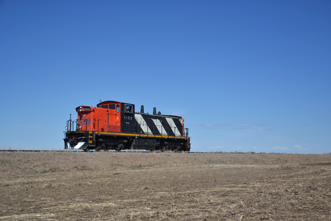 A scene that forever belongs to the past. The crew had brought 1432 to a stop so I could get a virtually unobstructed photo in one of the countless fields that hug the track. Im not sure if theres anything else on this planet that would scream Saskatchewan than a GMD-1 silhouetted against an open sky. The provinces catch phrase, land of the living sky, seems to hold true.

Ticks always seem to find a way, with grass and dry shrubs sparse and no higher than ankle high, they always seem to exist in the weirdest, most secluded places. But then again, where deer exist and graze, so do they. Thankfully, caught the culprit before it could get a bite.
