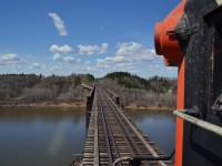 On the pilot looking West is quite a site.

This river, culminates into one of the signature attractions on the line, the historic “ Crooked Bridge “ over the Saskatchewan River. Construction on the bridge began in 1928 and was completed in January of 1930. 

What the bridge is most synonymous and recognized for, is the uncommon double deck girder plate design, incorporating a 16ft roadway directly under the upper railway deck. This is a similar design to the Fraser River bridge in New Westminster, B.C. for comparison. The bridges total length sits at 1,906ft, making it one of the largest steel bridges in Western Canada. 
