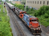 L56831 09 departing Kitchener for Stratford with GTW 4623, CN 4716, and CN 9555 leading the way of their 37 car train. Definitely didn't have a blue GP9R leading on the 2026 bingo card!