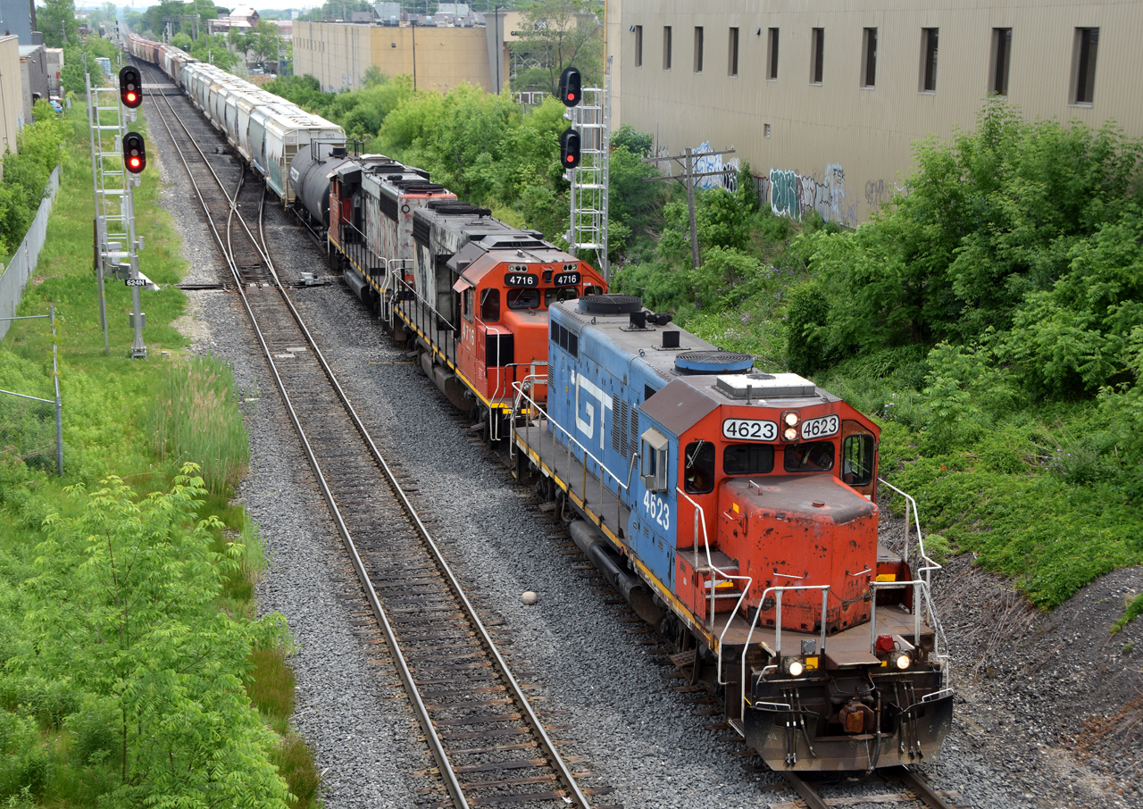 L56831 09 departing Kitchener for Stratford with GTW 4623, CN 4716, and CN 9555 leading the way of their 37 car train. Definitely didn't have a blue GP9R leading on the 2026 bingo card!