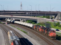 CN 401 has CN 2517, CN 8963, CN 9584 & CN 5627 for power and a string of TankTrain cars as it emerges from the Turcot Interchange. At left is the start of a cut of grain cars, a common sight on Track 29.