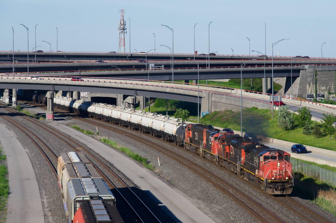 CN 401 has CN 2517, CN 8963, CN 9584 & CN 5627 for power and a string of TankTrain cars as it emerges from the Turcot Interchange. At left is the start of a cut of grain cars, a common sight on Track 29.