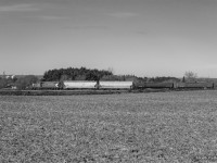 The corn has recently come off the field, and propane traffic is on the rise for the OSR to supply the numerous corn driers in the region.  Rolling down the last few miles of the St. Thomas Subdivision, GP9u 1591 throttles up after clearing Ferguson Line.
