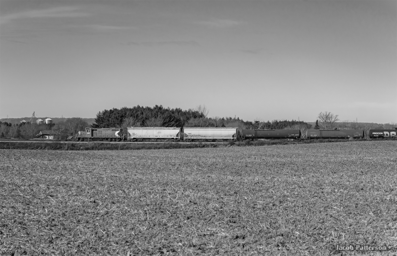 The corn has recently come off the field, and propane traffic is on the rise for the OSR to supply the numerous corn driers in the region.  Rolling down the last few miles of the St. Thomas Subdivision, GP9u 1591 throttles up after clearing Ferguson Line.