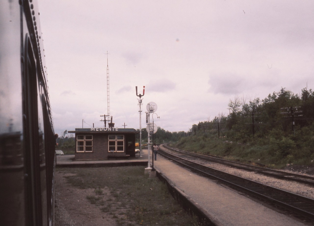 A shot of the Medonte station taken from the vestibule of a CN coach on a UCRS excursion to Midland. The operator appears to have finished inspecting the train. The excursion ran up CP's Mactier sub to Medonte, transferred to CN's Midland sub via a short piece of the Port McNicoll sub and the shoofly connection in Coldwater. Return to Toronto was via CN's Newmarket sub. Photo by my brother.