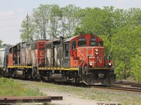 CN 4141 leads the local after holding at Lihou for an eastbound to run ahead of it.