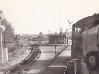 A view of the Medonte station taken from the lead unit of the Port McNicoll roadswitcher. The track on the left is the connection to the Port McNicoll subdivision with the mileboard for Coldwater seen on the right. It must be summer as the air conditioner has been installed in the waiting area window. The date is approximate. Unknown  photographer from my collection.