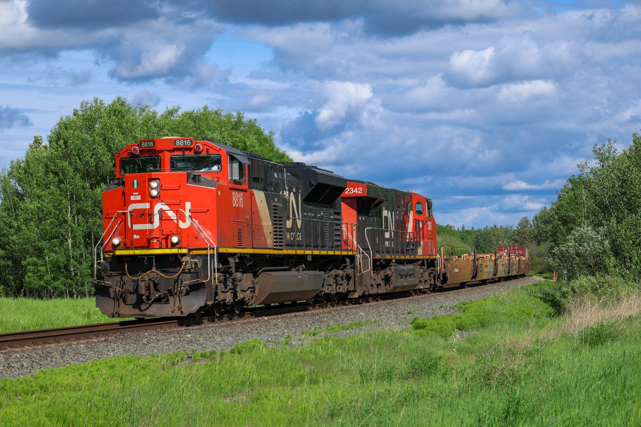 CN 8816 and CN 2342 bring up the rear of a three train fleet as they pull Chicago to Prince Rupert train Q 1999 08 out of Wabamun.