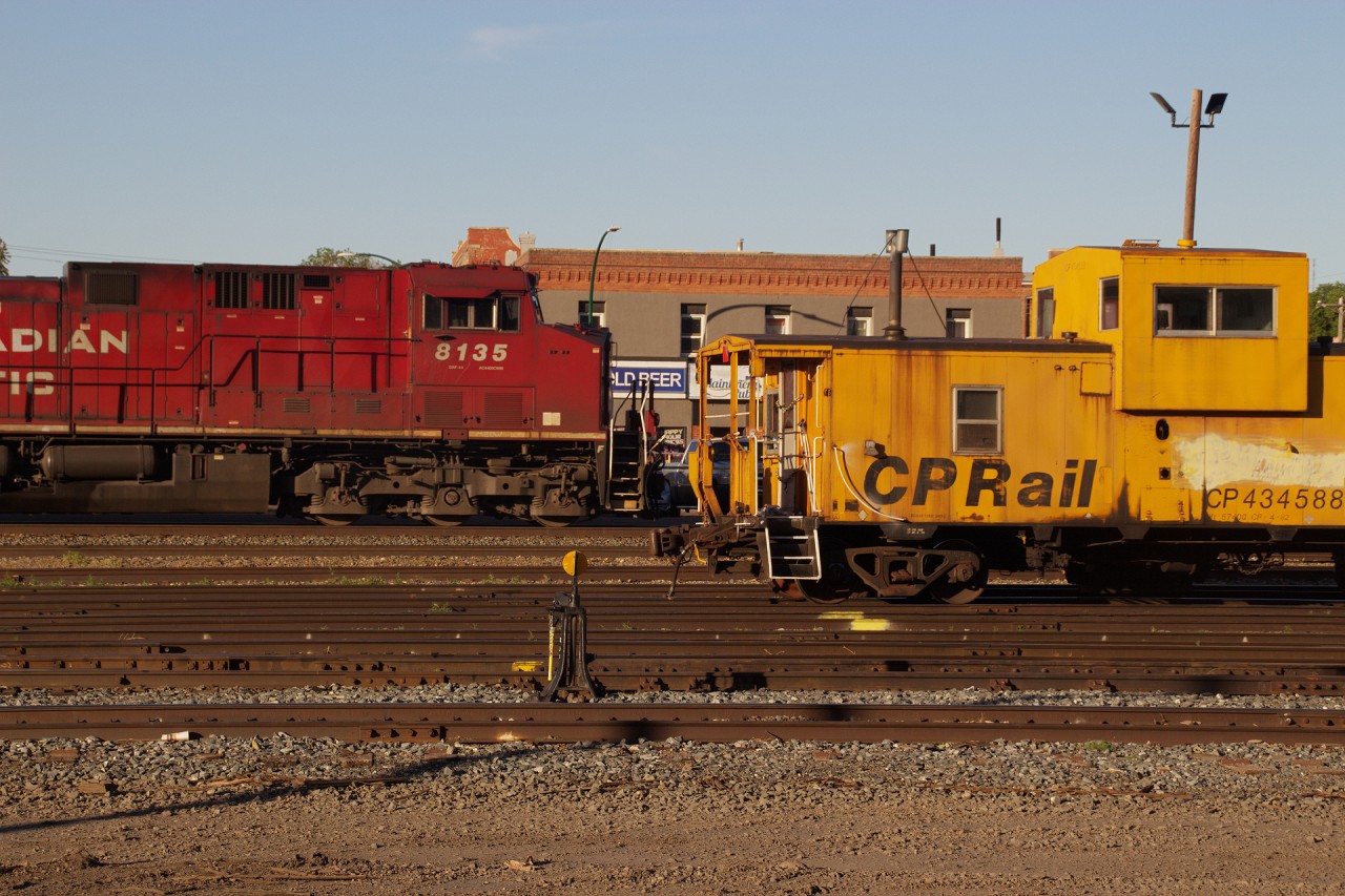 CP 8135 passing by an old CP rail Caboose in Medicine Hat