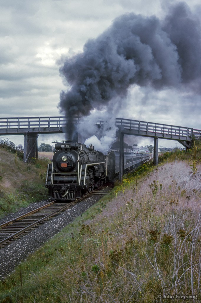 Blasting out of Paris, CNR 6167 leads her excursion up the Drumbo Subdivision, bound for Stratford with excursionists from the Michigan Railroad Club, operating Windsor - Paris - Stratford - Windsor.

Scan and editing by Jacob Patterson