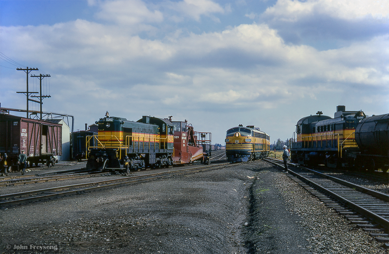 Lots of activity at North Bay as GMD FP9s 1504 - 1510, the power for North Bay - Engleheart mixed train M411, pass between MLW RS3 1309, paused during switching moves, and ALCO S2 1202, seen moving spreader 529 around the yard.  Built in 1957, Paul O'Shell shot this spreader back in 2014.

Scan and editing by Jacob Patterson.