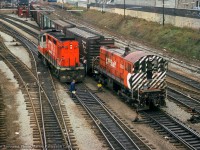 CP 7021 brings a transfer through TTR Bathurst Street, passing CN 3154, one of CN's 5 RS18ms, modified for Tempo commuter service.

<br><br><i>John Freyseng Photo, Jacob Patterson Collection Slide.</i>