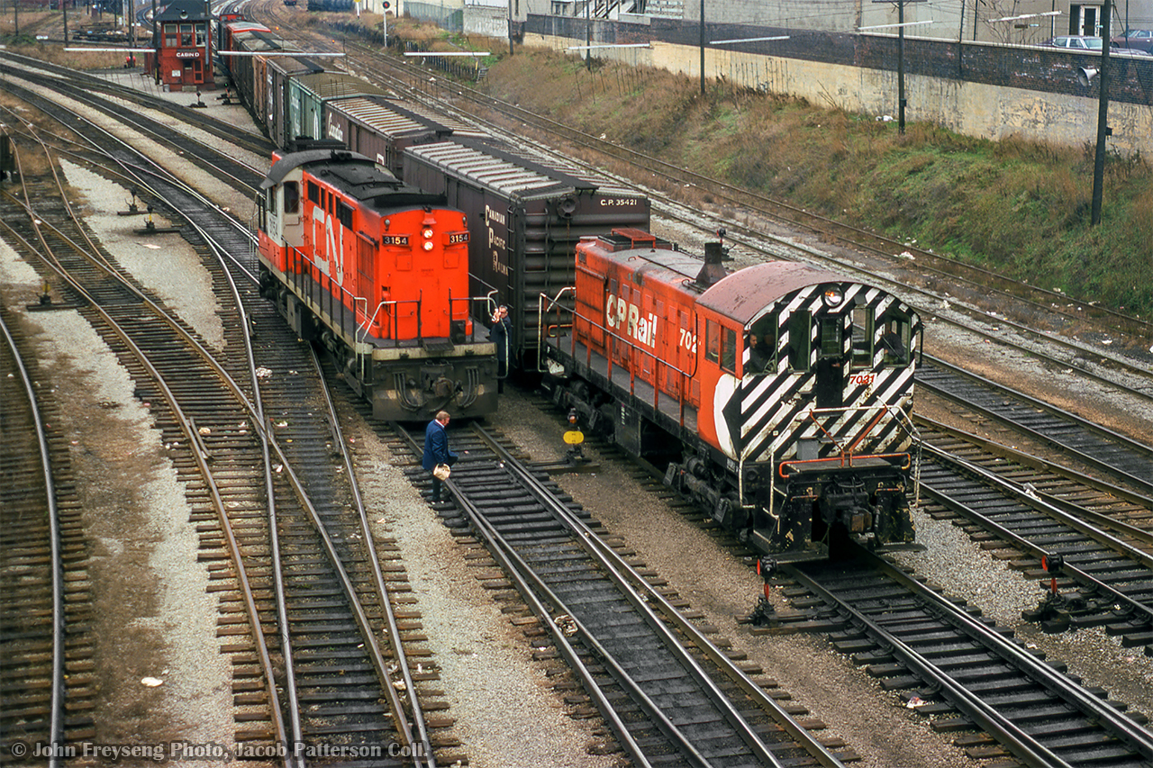 CP 7021 brings a transfer through TTR Bathurst Street, passing CN 3154, one of CN's 5 RS18ms, modified for Tempo commuter service.

John Freyseng Photo, Jacob Patterson Collection Slide.