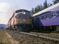 Deep in the woods of northern Ontario, The Confederation train is "somewhere between Port Arthur and Franz," taking the siding for a meet with Canadian Pacific's westbound <i>Canadian.</i>  Upon arrival at Franz, the Confederation train will take the CPR/ACR interchange track, headed south to the Sault.  Chesley Maidment was able to capture this rare view, and others, while spending the year (yes this trip <a href=https://expo67.ncf.ca/Confederation%20Train%20Tour%20Dates.pdf>took a full twelve months) working as a labourer aboard the train.