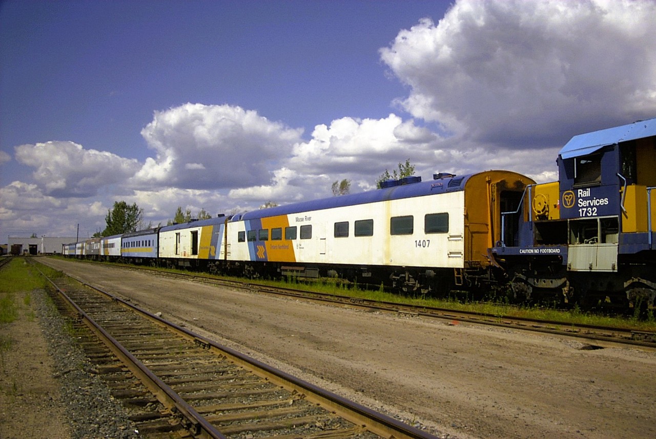 Passenger train to nowhere  
A plethora of retired passenger cars sit on a deadline in ONR's North Bay, ON yard on May 4, 2004. 
ONR equipment in the lineup originated from many different roads such as CN, CP, GO Transit, L&N, N&W, and VIA Rail. 
Coupled to the nose of ONT 1732 is ONT 1407 Moose River. This car was built by Pullman Standard in July 1954 for CN as their CN 908 Luster Lake, Class PC-79-A Buffet Parlor car. It was transferred from CN to VIA in March 1978 and was sold to ONR in 1986.